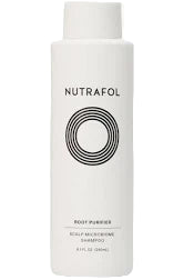 Nutrafol shampoo bottle on a white background